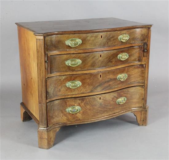A George III serpentine mahogany dressing chest, W.3ft 7.5in. D.1ft 11.5in. H.2ft 8in.